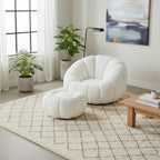 Set poltrona girevole con pouf poggiapiedi in tessuto bouclè - Nuvola